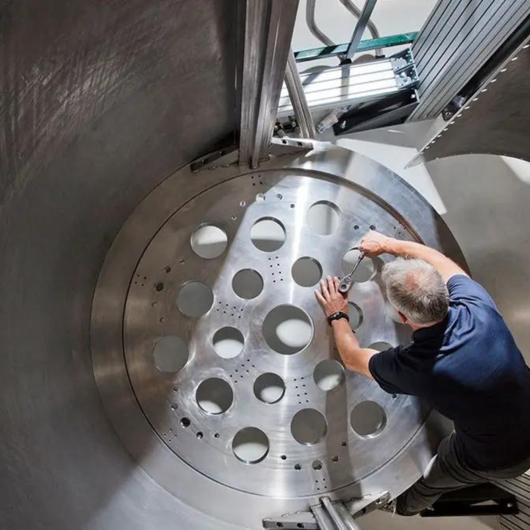 Pat Gumann, IBM Research staff member, and Goldeneye technical lead, adjusts the bottom of the 