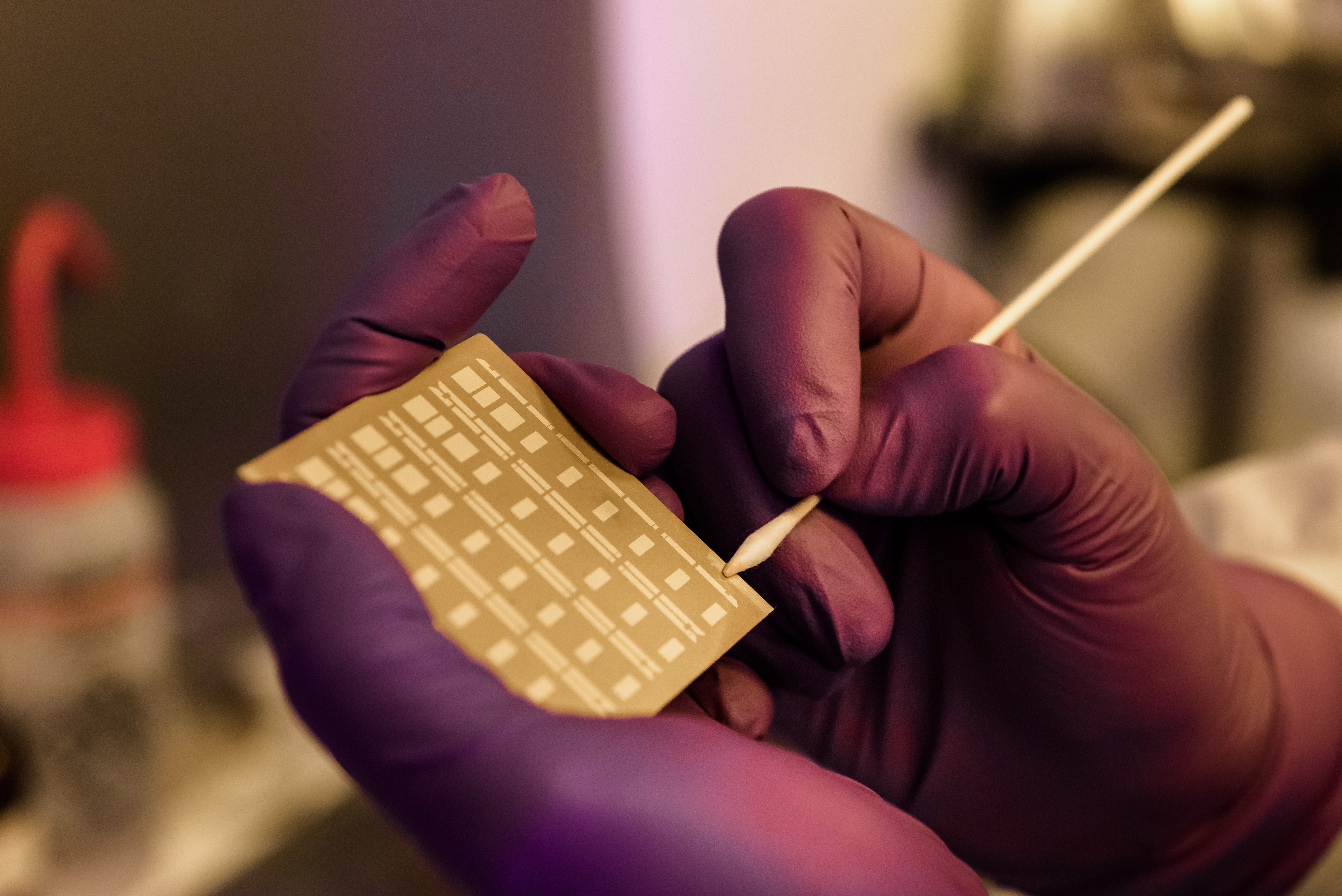 Thin film technician processing a resistor board. Credit: XMA Corporation