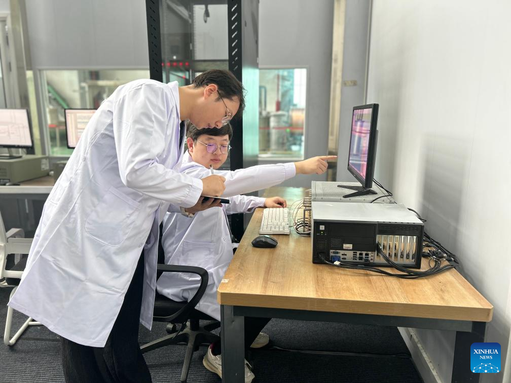 Researchers of the Chinese Academy of Sciences' Institute of Plasma Physics (ASIPP) record experiment data in Hefei, Anhui Province, China, Sept. 28, 2025. Credit: Xinhua/Wu Huijun