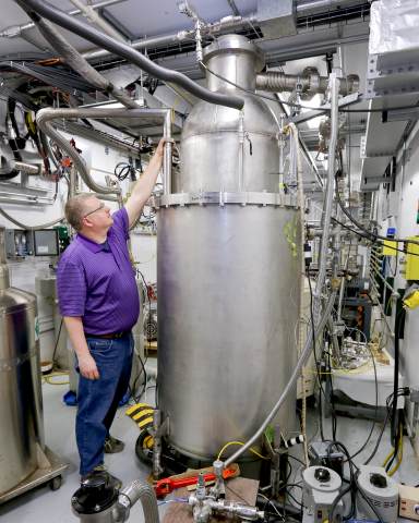 Robert Duckworth overseeing the testing of the nine-foot-tall ITER cryoviscous compressor pump prototype at the Spallation Neutron Source cryogenic test facility. Image: US ITER/ORNL