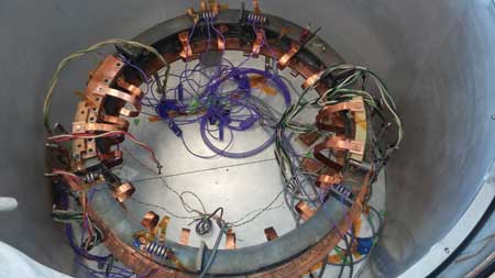 Assembly of 1-meter-diameter Hyper Tech conduction cooled coil into test cryostat at OSU CSMM. Image: Hyper Tech