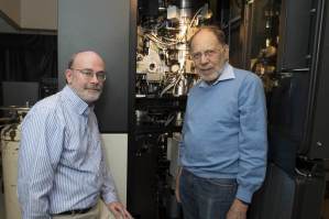 Dr. Michael Rossmann (right) and Dr. Richard Kuhn stand with the cryo-electron microscope used to determine the structure of the Zika virus. Image: Purdue University, Mark Simons