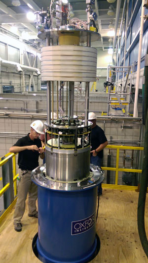 Engineers lower the 32-T into its cryostat. Image: MagLab