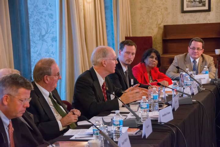 Middle right, participants at the roundtable on national laboratory partnerships held in Chicago in November. Left to right: US Representative Randy Hultgren (R-IL), Lane (hidden), Fanton, US Rep. Bill Foster (D-IL), Fermi National Accelerator Laboratory Chief Operating Officer Tim Meyer, Fermilab scientist Pushpa Bhat and Argonne National Laboratory Director for Strategy and Innovation Gregory Morin.